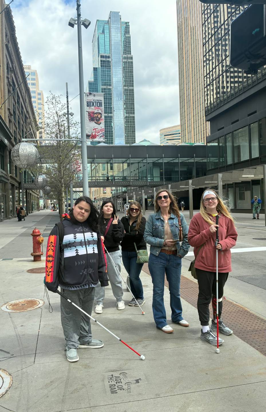 Lilly (center) with students on a trip to the Twin Cities.